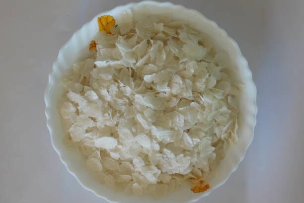 Closeup of beaten rice food in a bowl isolated on a white background