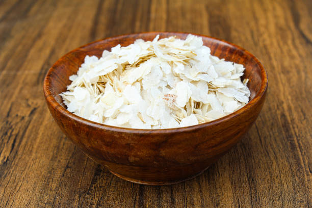 Poha or chivda in a wooden bowl close up